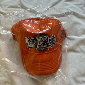 🍊BRAND NEW WITH TAGS ORANGE ESCAPE FESTIVAL TRUCKER HAT WITH SAW LOGO🍊